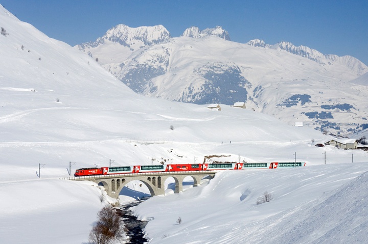 The Glacier Express scenic mountain train in the snow