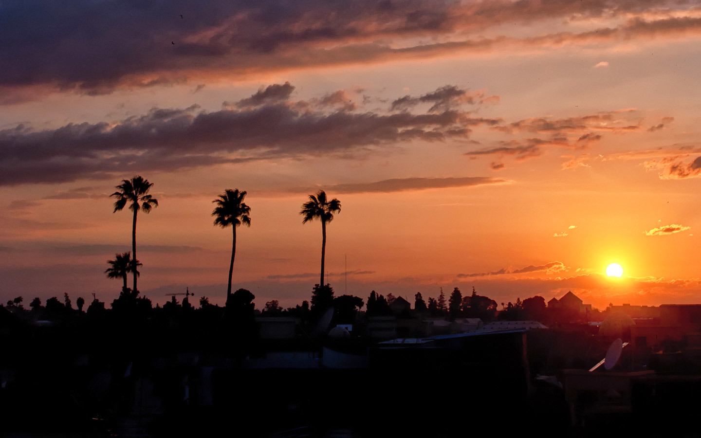 Sunset over the medina in Marrakech from Riad Capaldi roof terrace