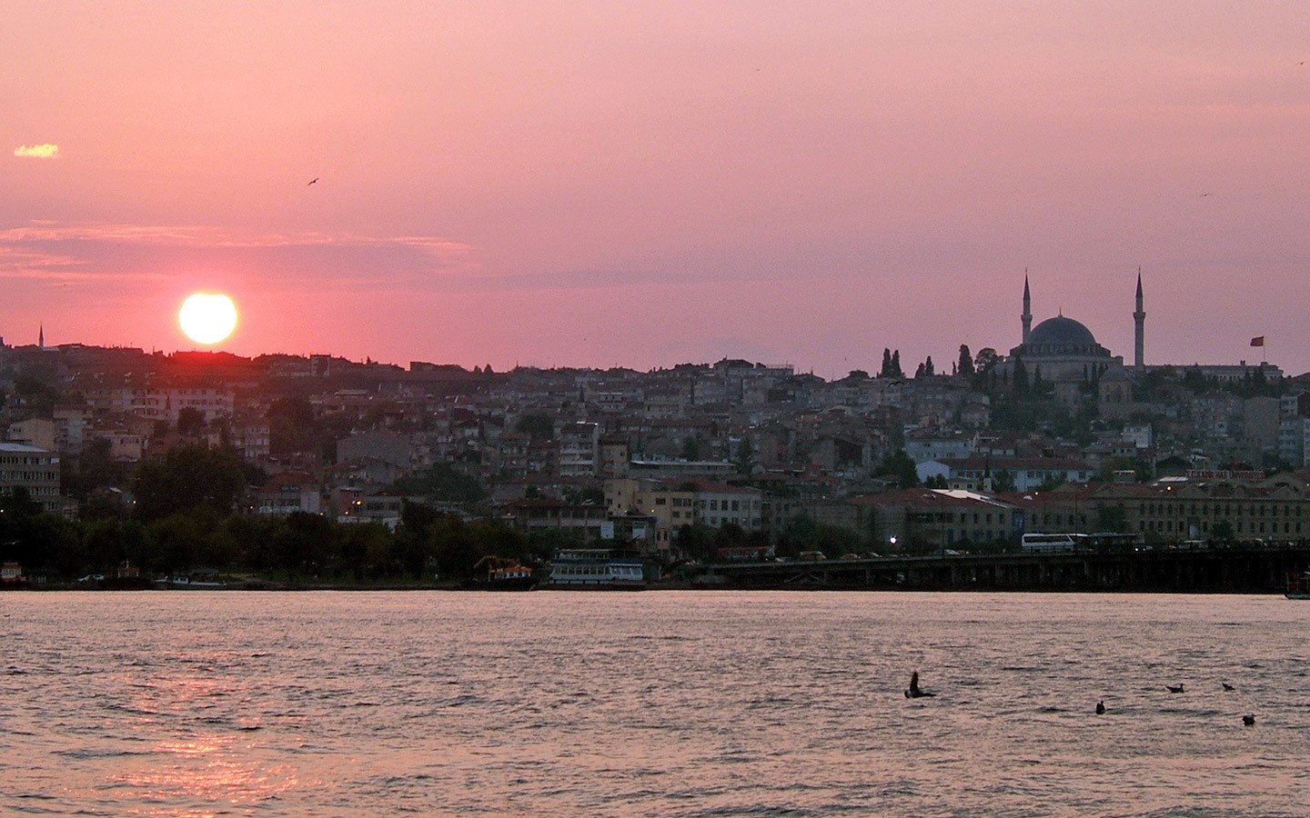 Pink sunset over Sultanahmet from the Galata Bridge