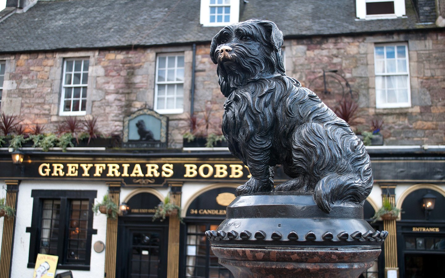 Greyfriars Bobby's statue and his namesake pub in Edinburgh