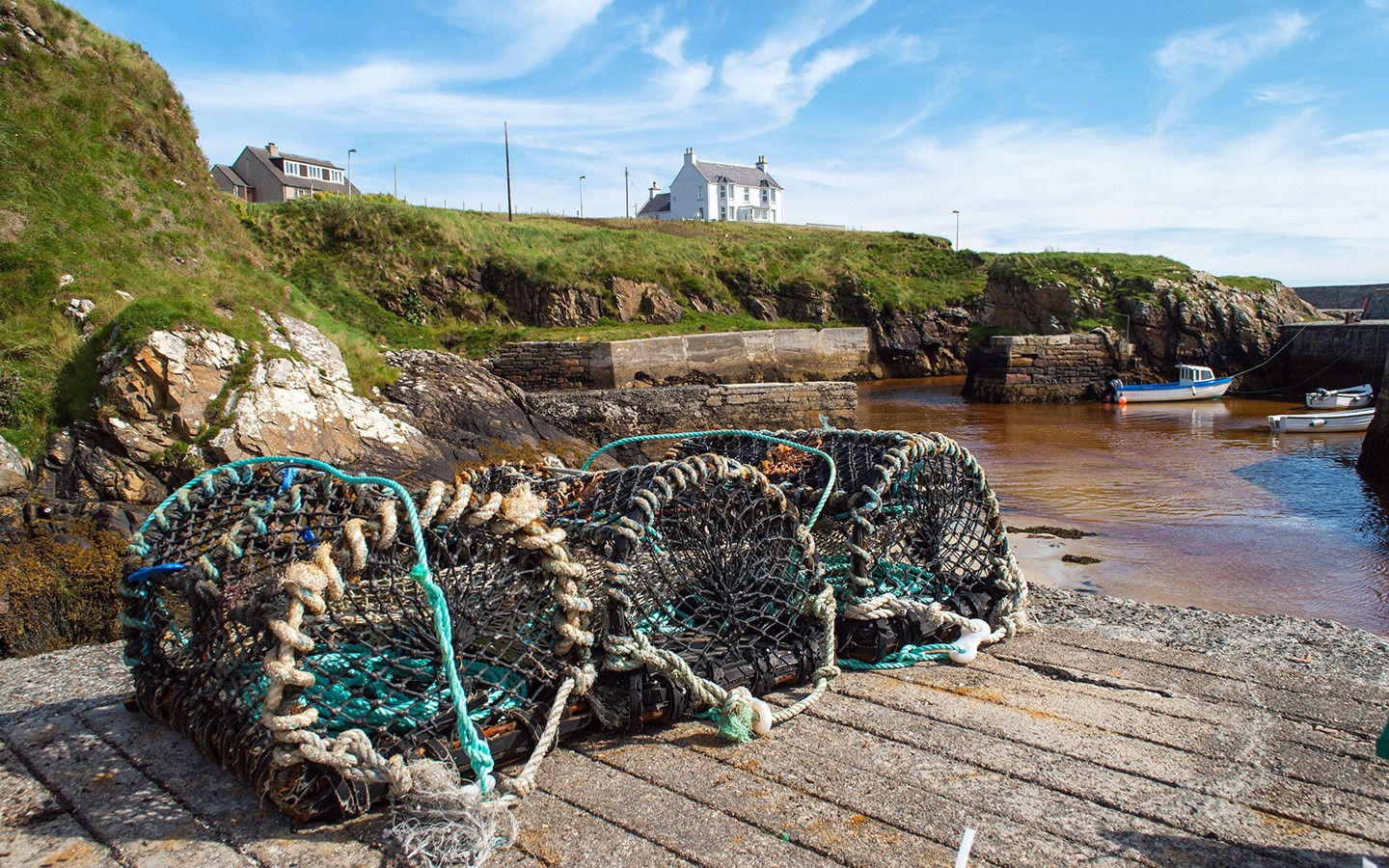 Lobster pots in the harbour at the Port of Ness, Outer Hebrides